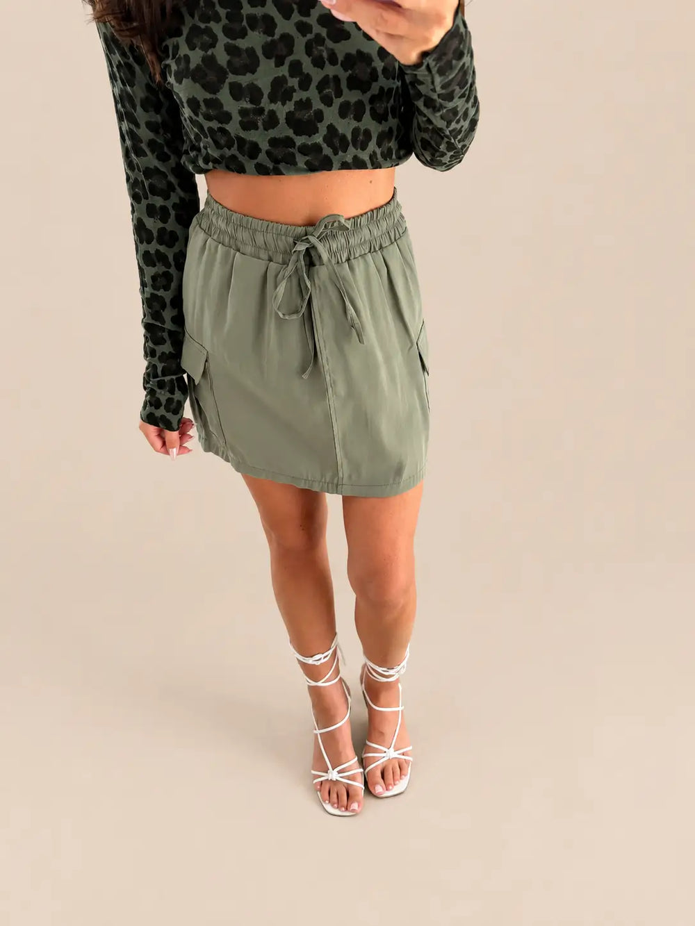 Women’s cargo skirt in Khaki with a drawstring waist and patch pockets | Lisa’s Boutique