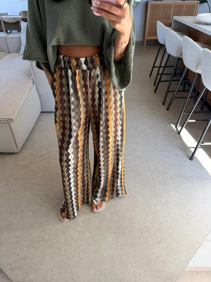 Women’s patterned trousers in Khaki with a wave print and a khaki sweater | Lisa’s Boutique