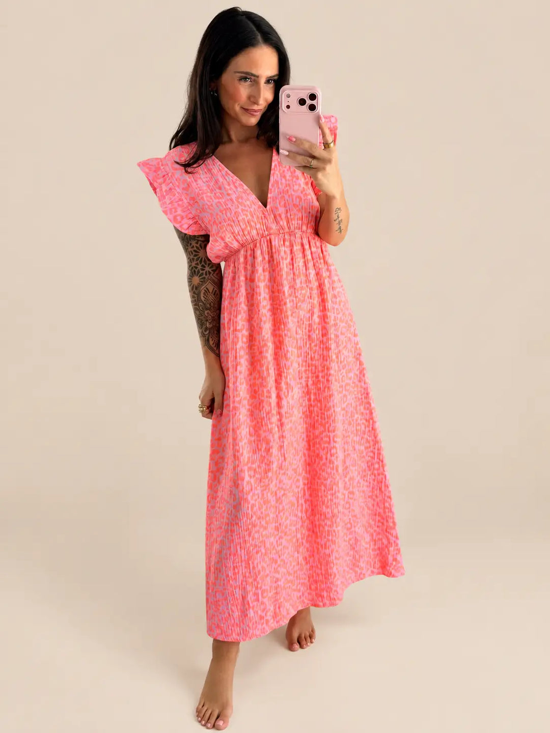 Vestido de leopardo mujer en naranja con escote en pico y mangas cortas | Lisa’s Boutique