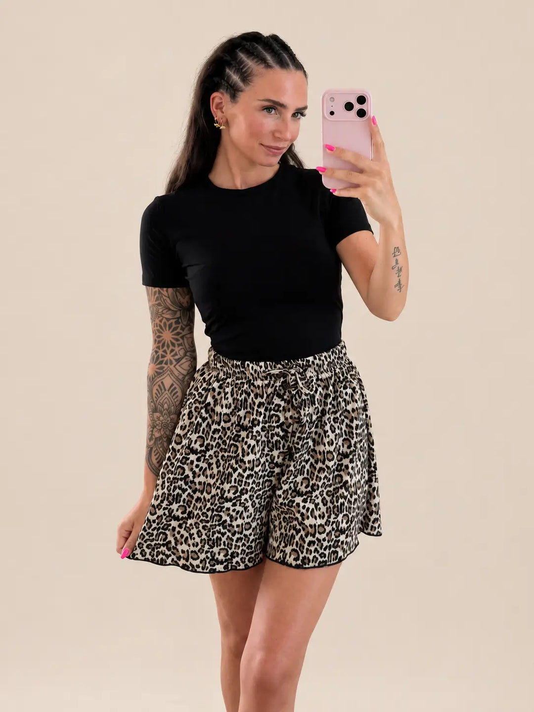 Women’s leopard print shorts in Beige and Black, styled in an outfit | Lisa’s Boutique