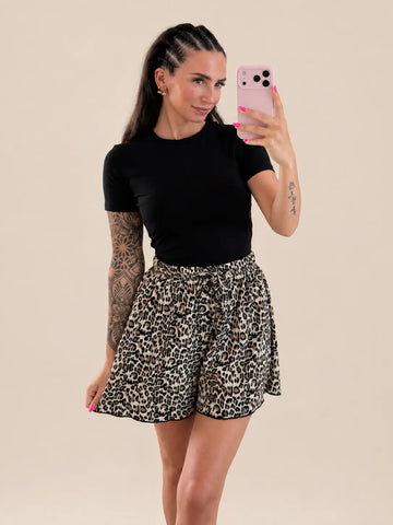 Women’s leopard print shorts in Beige and Black, styled in an outfit | Lisa’s Boutique