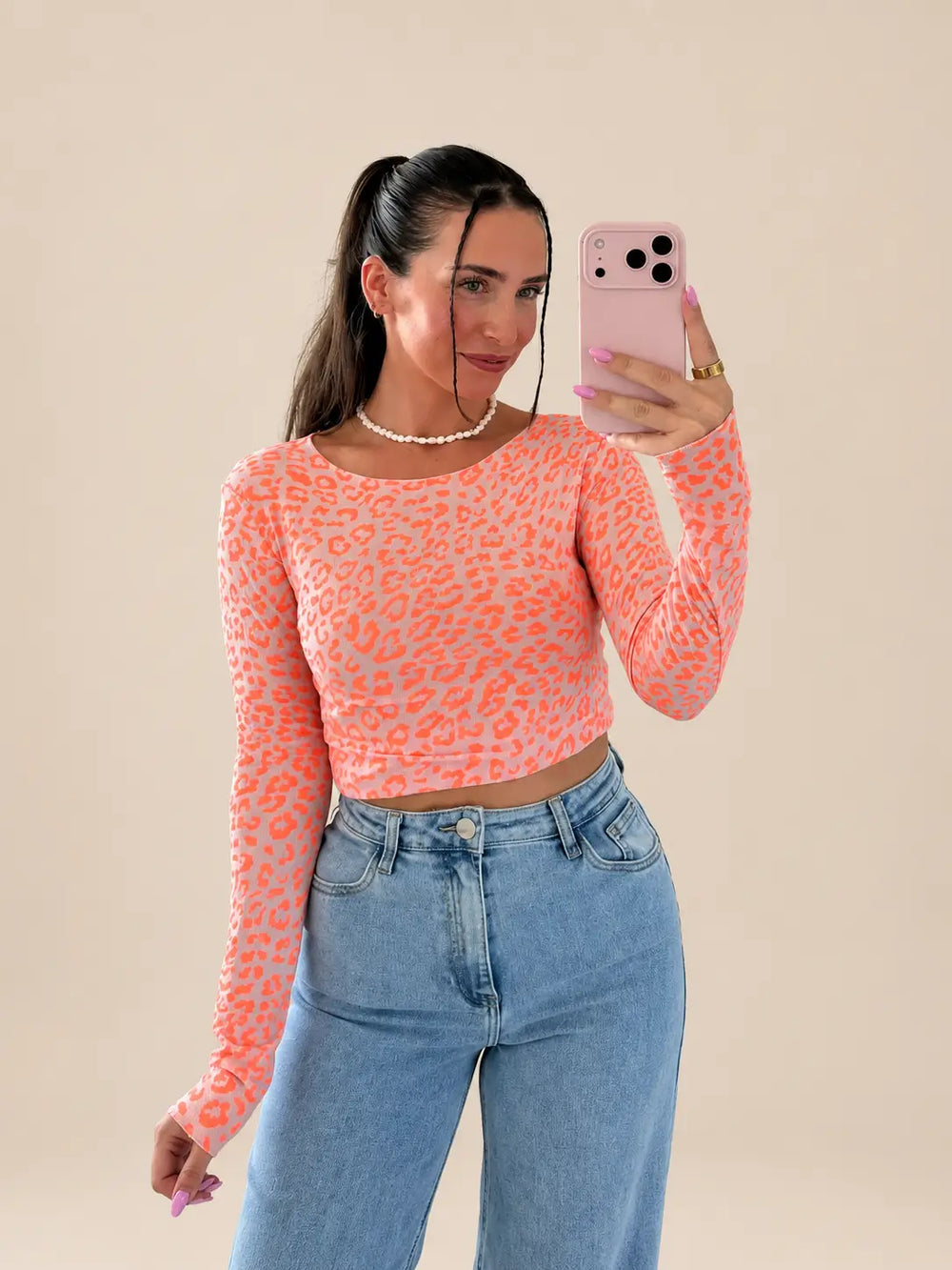 Detail view of orange leopard print shirt | Lisa’s Boutique