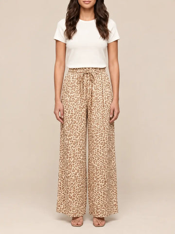 Women’s leopard print loose fitting trousers in Beige, side view | Lisa’s Boutique