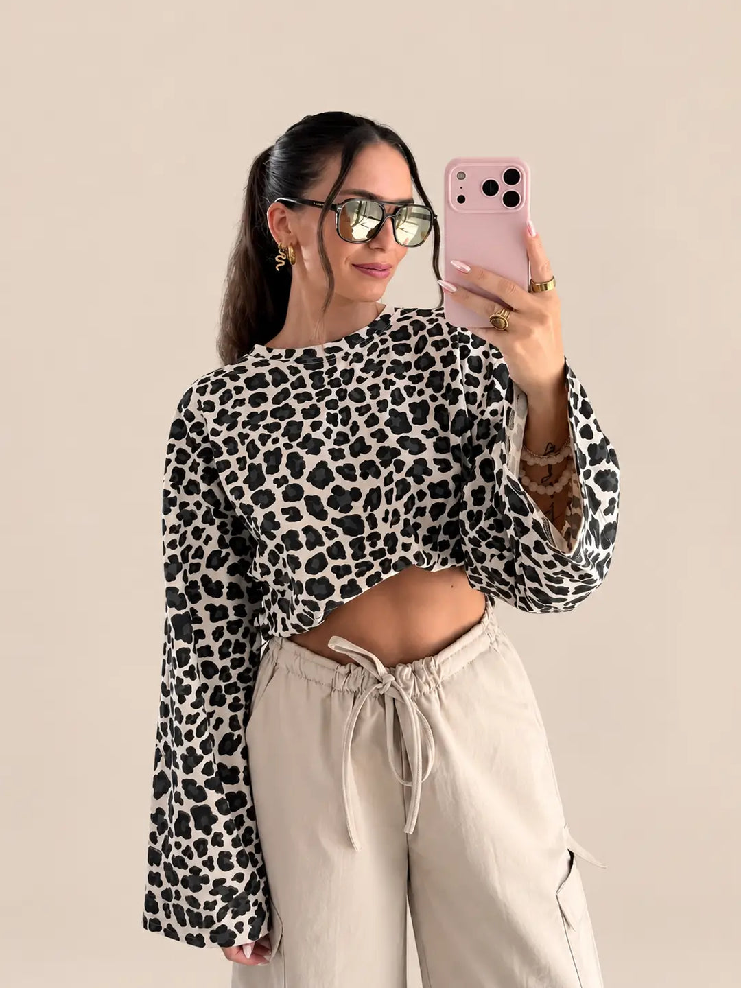 Women’s long sleeve top in Beige with an allover leopard print and a round neckline | Lisa’s Boutique