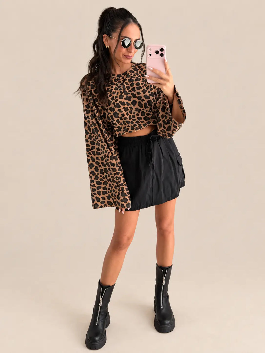 Women’s long sleeve top in espresso with leopard print, styled with cargo skirt | Lisa’s Boutique