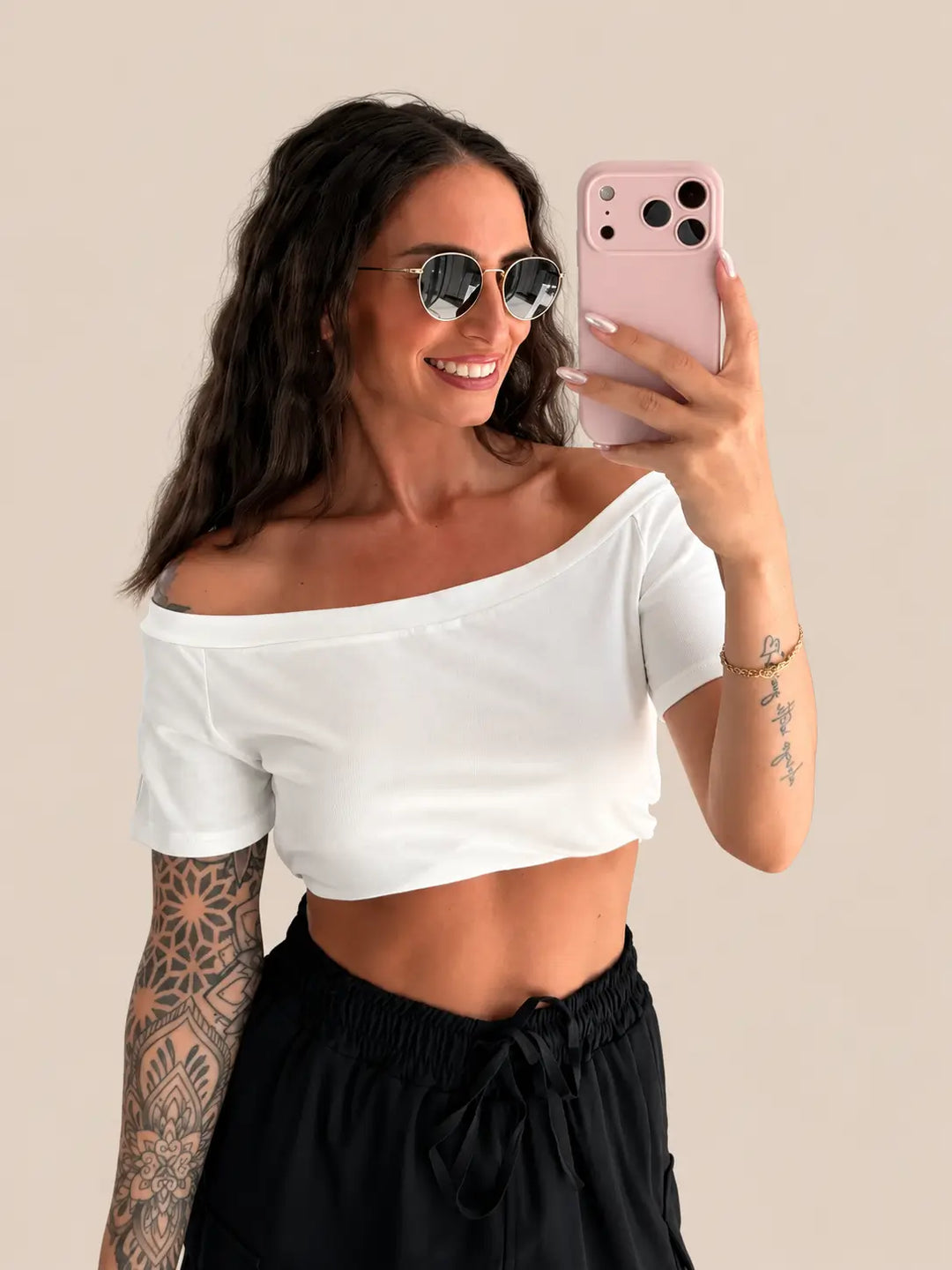 Women’s off shoulder top in White with a bare shoulder neckline and a fine rib texture | Lisa’s Boutique