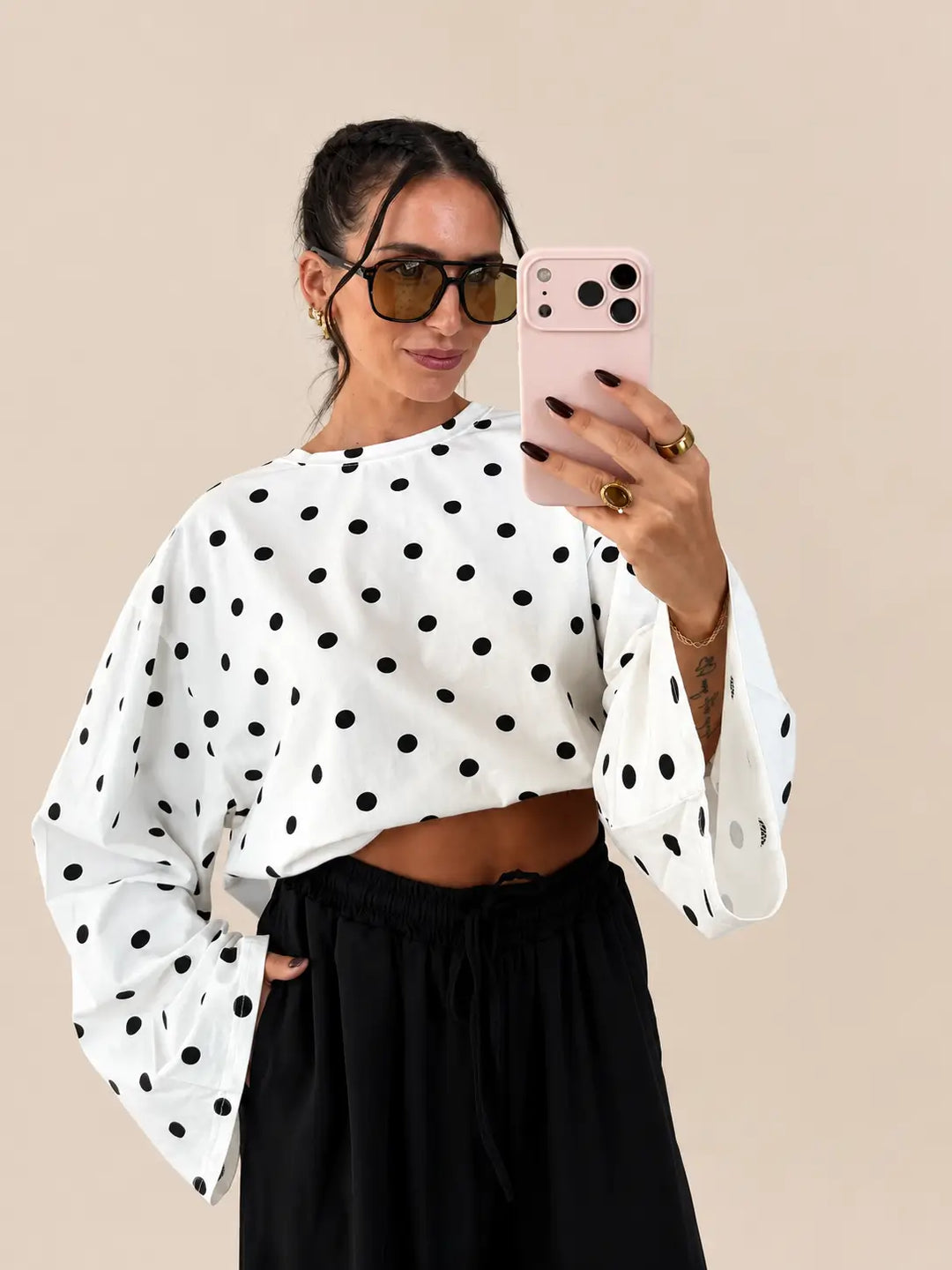 Oversize polka dot longsleeve women’s in white, closeup with black trousers | Lisa’s Boutique