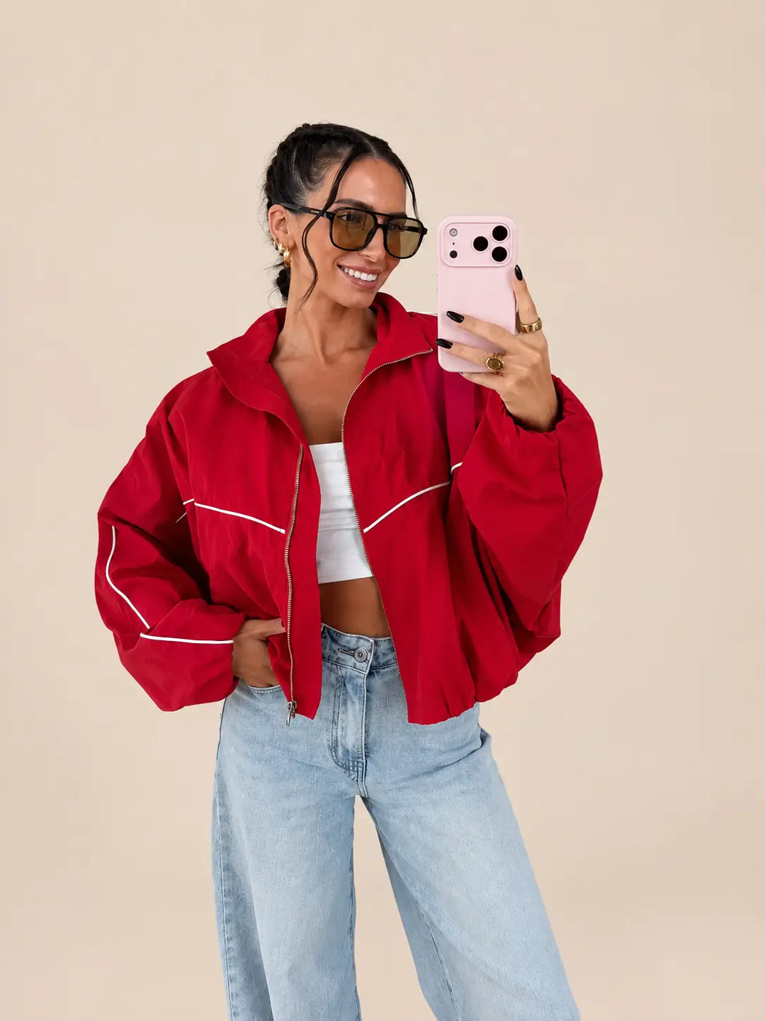 Women’s oversized blouson jacket in Red with contrast piping and wide sleeves, styled with jeans | Lisa’s Boutique
