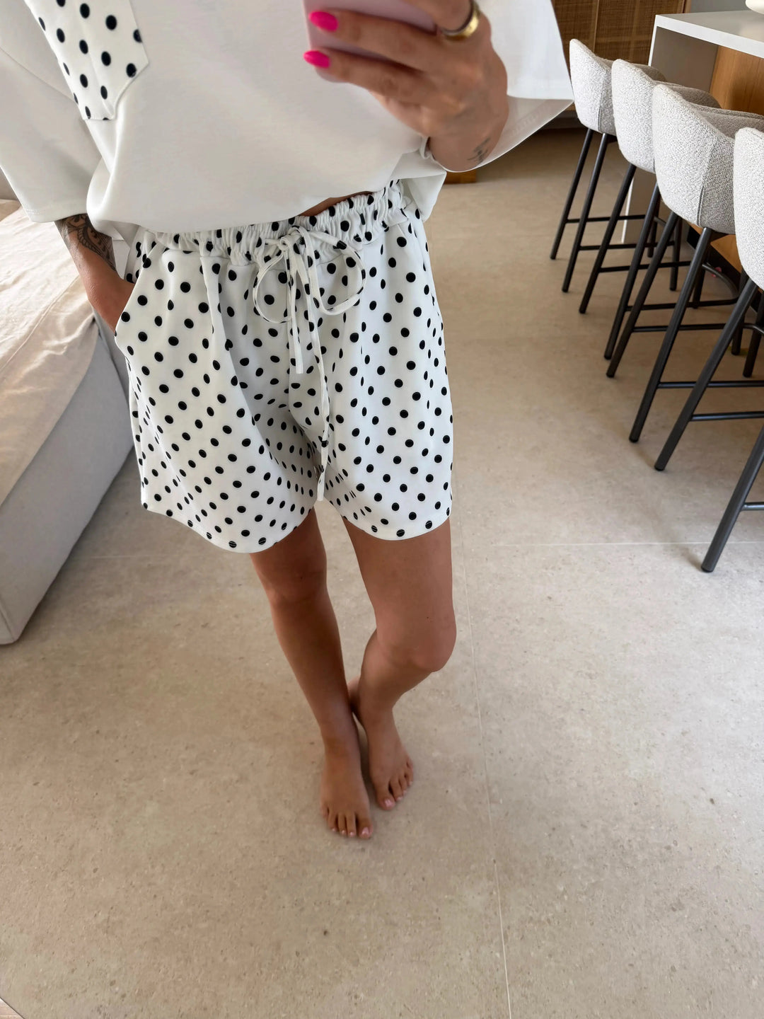 Polka-Dot Shorts – White – close-up on a model | Lisa’s Boutique