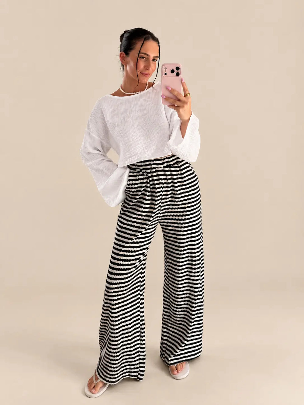 Detail view of black knit striped trousers | Lisa’s Boutique