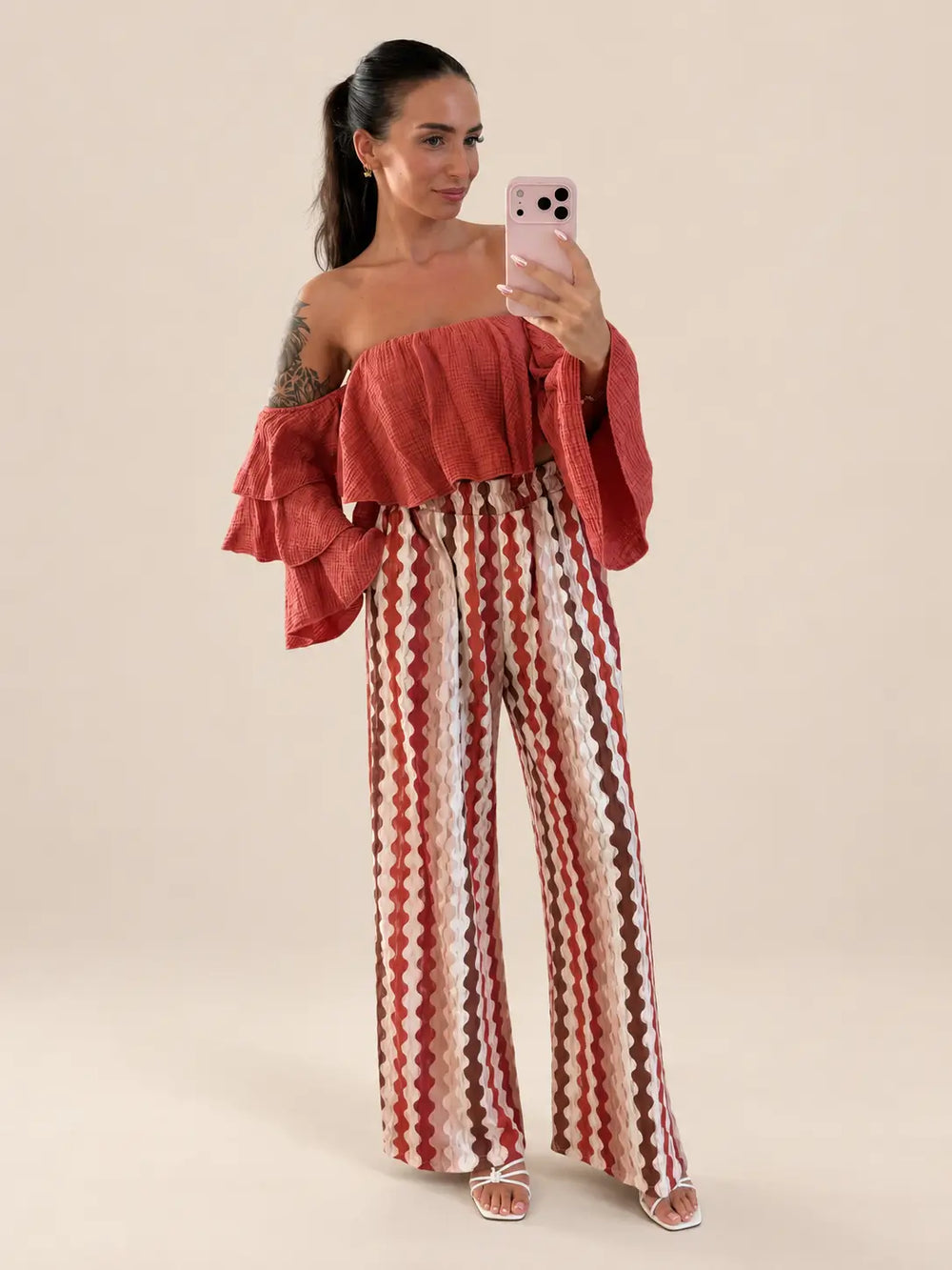 Women’s strapless muslin blouse in Rust with ruffles and patterned trousers | Lisa’s Boutique